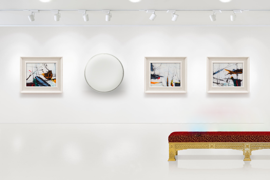 Modern art gallery with abstract paintings, round wall piece, and ornate red bench